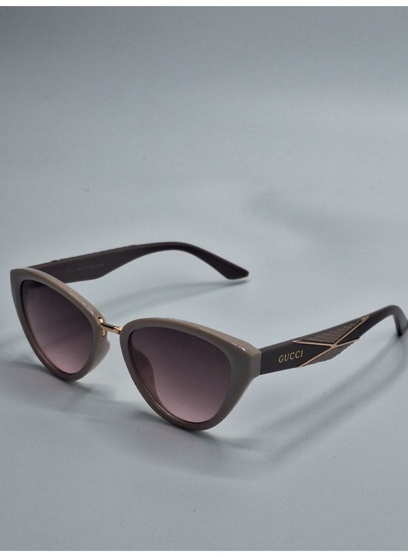 Gucci Women’s Cat-Eye Sunglasses – Grey Frame with Gold Detail and Gradient Lenses